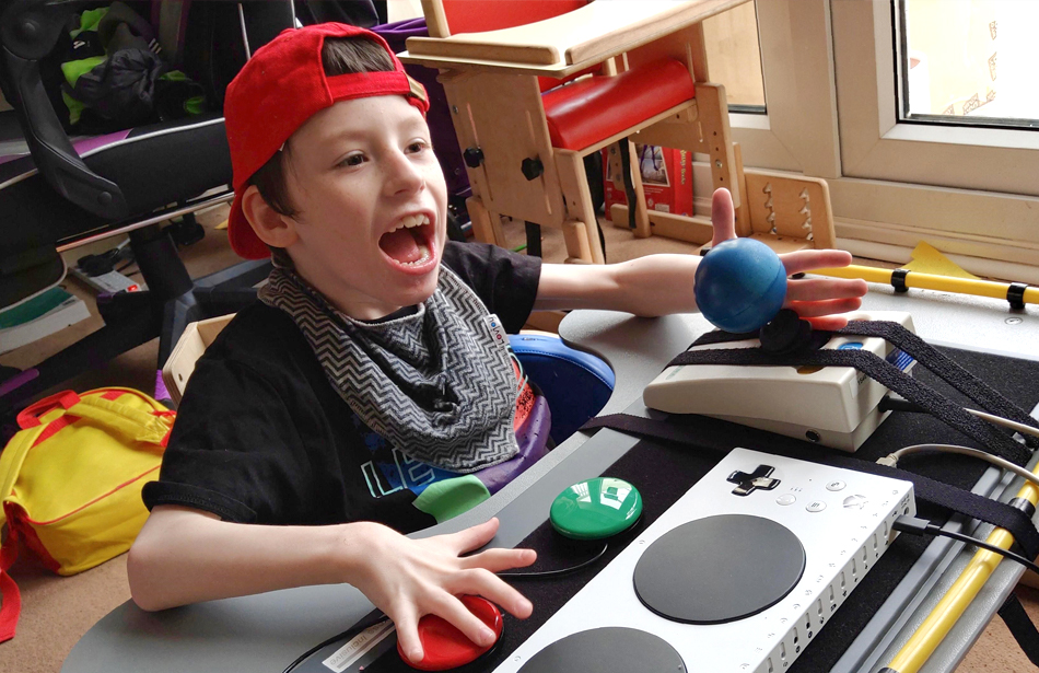 Seated boy playing games