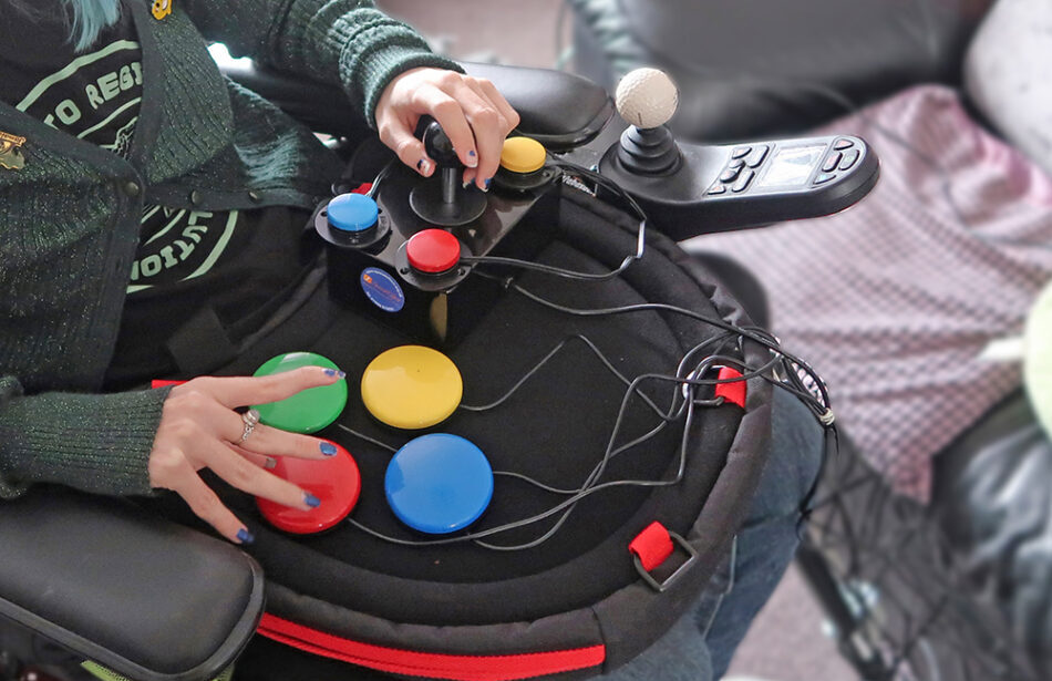 Close up of hands using adapted gaming control setup