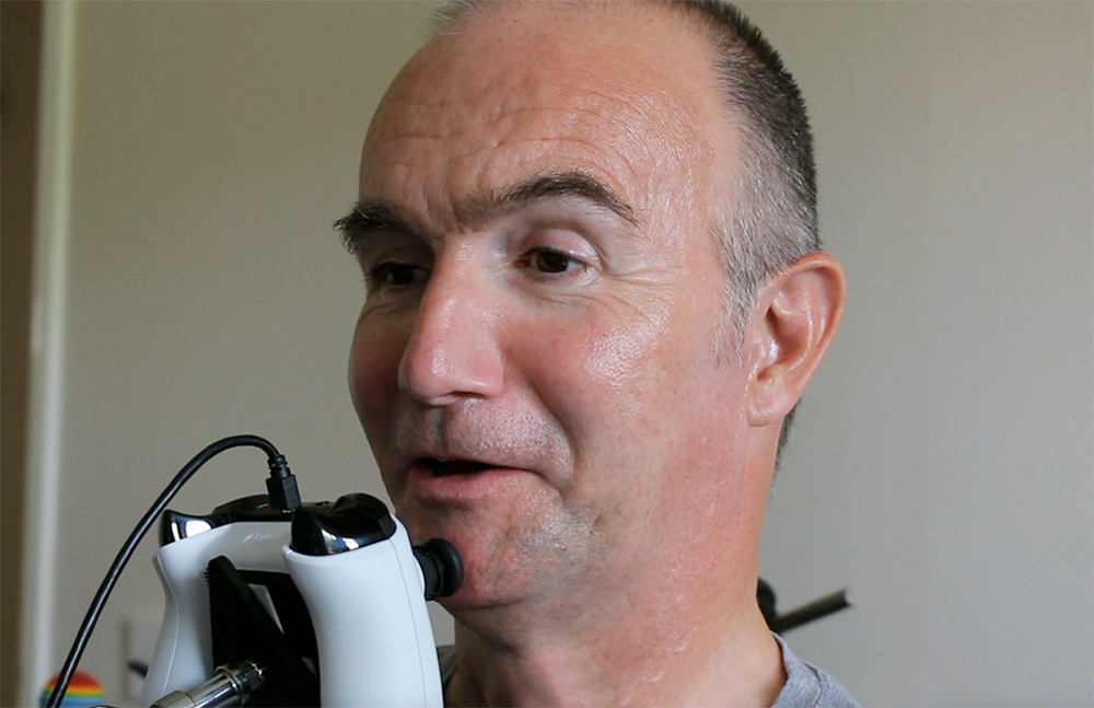 close up of man operating a chin joystick