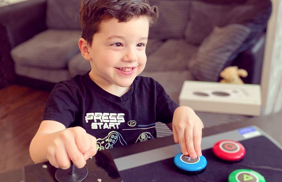 smiling boy playing video game