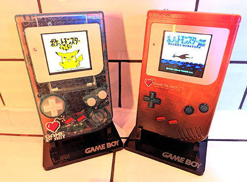 Two modded GameBoys with SpecialEffect branding
