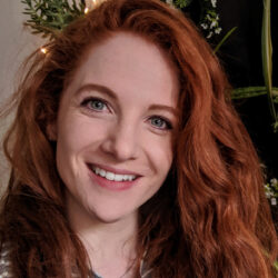 Portrait image of smiling woman with auburn hair