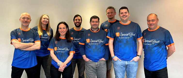 Group of eight adults in SpecialEffect tees