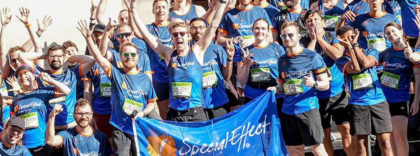 Group of celebrating runners in SpecialEffect T-shirts